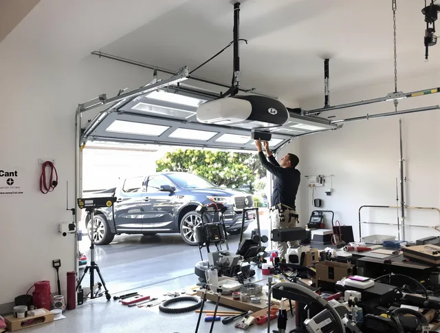 Clearwater Garage Door Repair specialist installing smart garage door opener system in Clearwater home