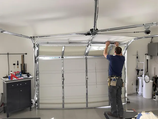 Clearwater Garage Door Repair specialist performing precise section replacement on Clearwater garage door